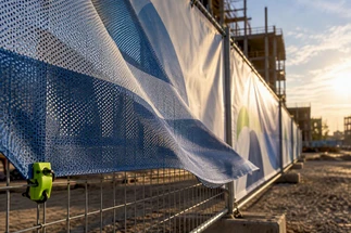Avoid Wind Damage: Choose Mesh or Vinyl Banners That Ship in Two Days
