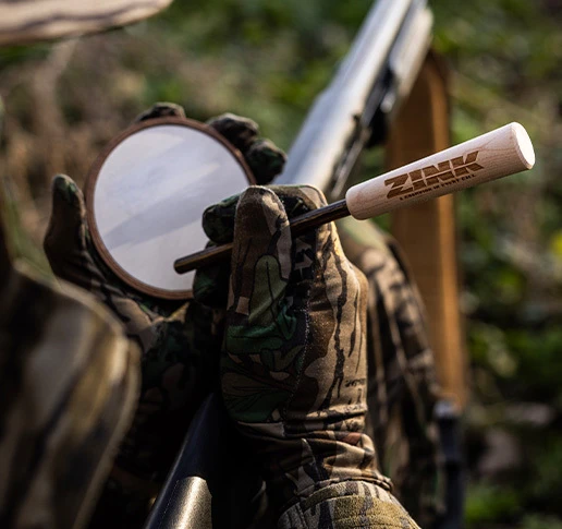 Turkey hunters on log