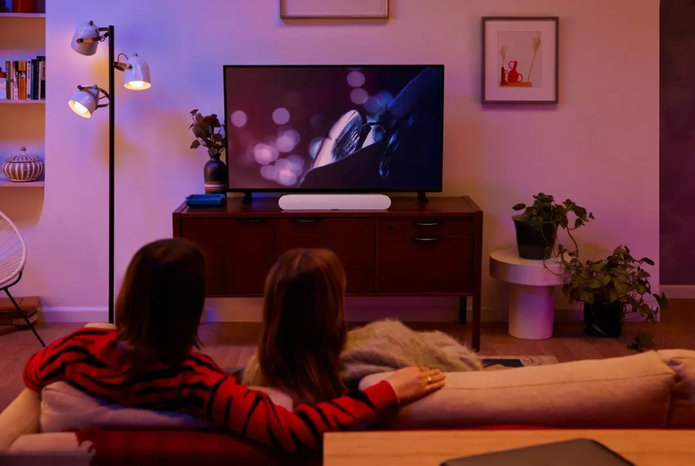 Sonos Ray soundbar in White beneath a TV in a modern living room