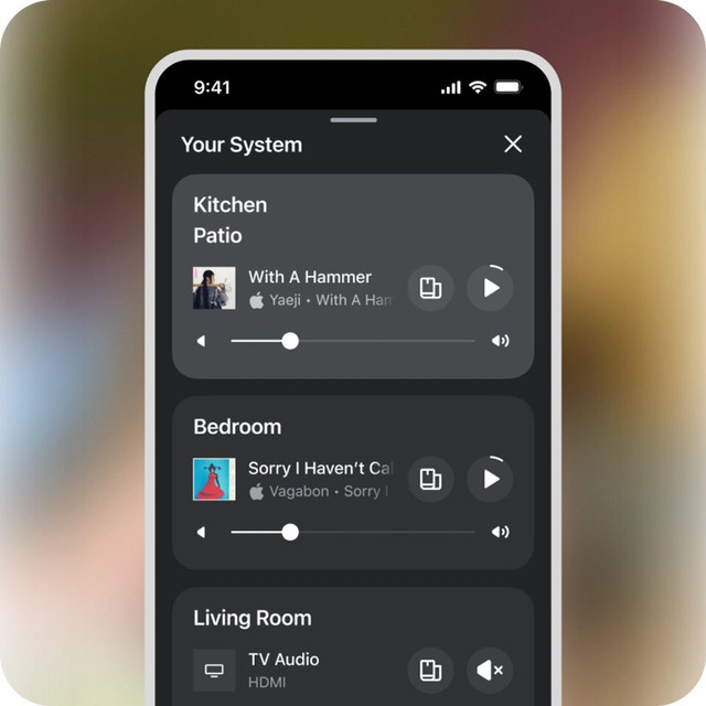 The Sonos app Your System screen showing music playing in the kitchen, patio and bedroom, and TV audio in the living room