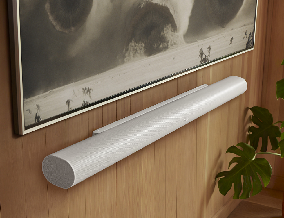 Sonos Arc Ultra shown in white, wall mounted & with a TV