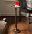 Jan Barboglio Mesita Redonda wax cast iron side table with round top and pedestal base
