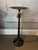 Jan Barboglio Mesita Redonda wax cast iron side table with round top and pedestal base