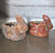 Clay potted rabbit measuring 11" long, 9" deep, and 9" tall.
