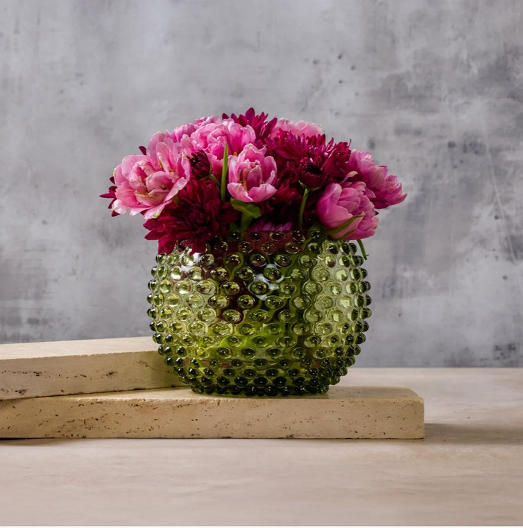 Close-up of hobnail texture pattern on moss green Bohemia crystal vase