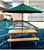 Wooden Picnic Table with Green Umbrella near an escalator