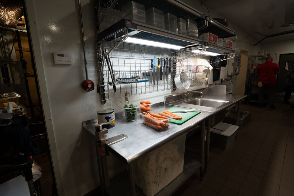 Metro SmartWall wall shelving system in a food prep area of a commercial kitchen