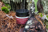 Arnica & Comfrey Soothing Rub, 2fl oz, amber glass with red label out in the wild