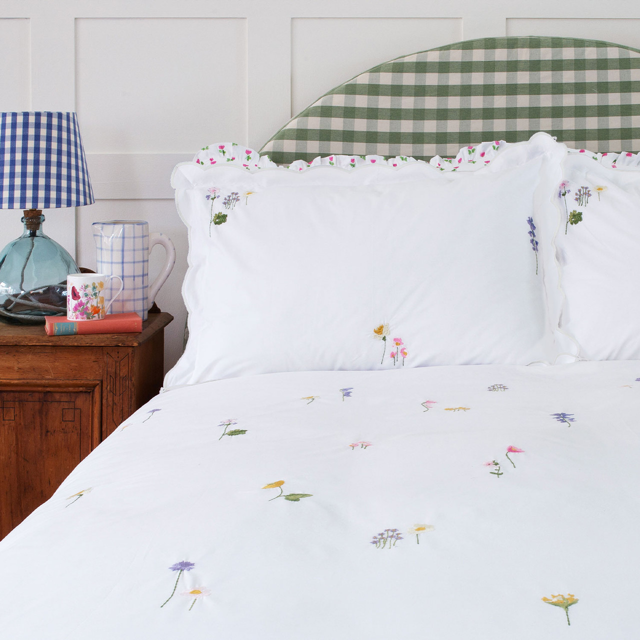Humble flowers embroidered duvet set on bed
