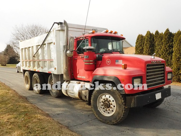 1998 350 hp R-Model Mack Tri Axle Dump Truck, features a 15.5-foot aluminum dump bed.