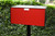 Red Metro front opening black modern mailbox on post - back view in red Red Metro front opening black modern mailbox on post - back view in red