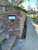 Metro Front Opening Black Modern Mailbox with white door installed in a brick wall Metro Front Opening Black Modern Mailbox with white door installed in a brick wall