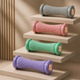 Three color variants of the PVC TPR foot roller massager — gray, purple and pink for heel and arch pain relief