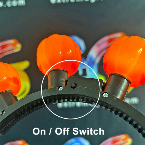 Light-Up Pumpkin Headband Bopper for Kids, Halloween accessory with an on/off switch on the headband.