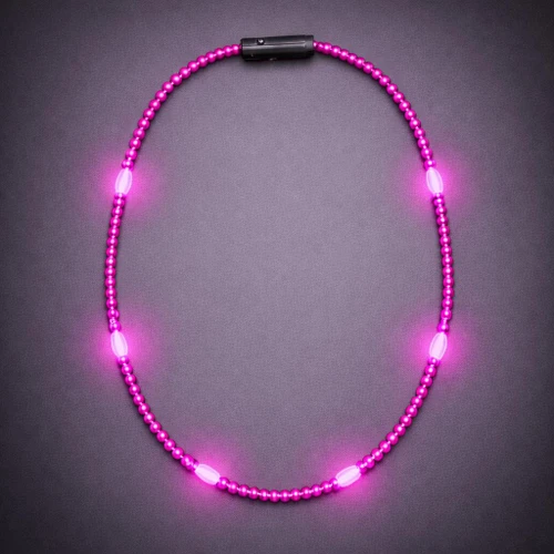 pink beaded necklace with LED lights on a dark background