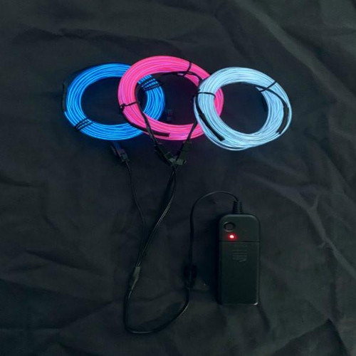 EL Wire Triple Play, three 6-meter (60 feet) EL wire rolls in blue, pink, and white colors arranged in a circle with a power control box, on a black fabric background.
