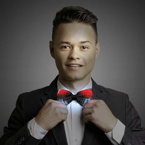 LED Sequin Bowtie, a colorful illuminated bowtie worn by a man in a formal suit.