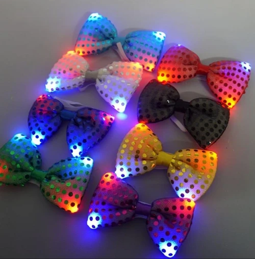 LED Sequin Bowtie, colorful illuminated bowtie with polka dot pattern and glowing LED lights in various colors.