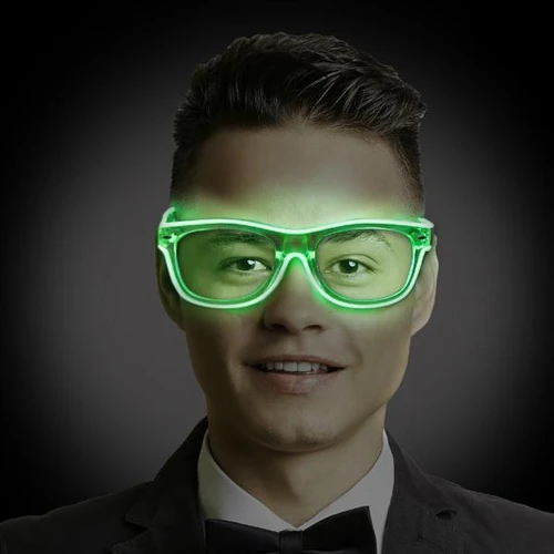 EL Wire Wayfarers + Clear Frames, man wearing glowing green LED glasses with clear frames in a dark background.