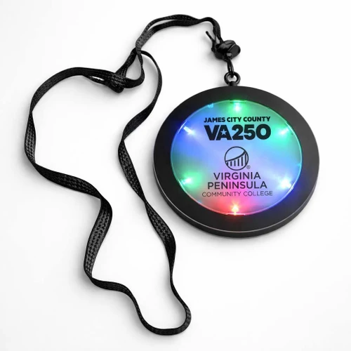 Customized Flashing Medallions, LED light-up badge with black strap featuring colorful flashing lights and customizable text for events or promotions.