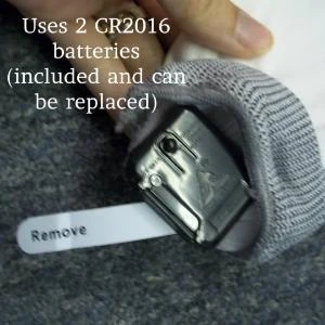 close-up of the glove with an attached battery compartment for replacing 2 CR2016 batteries