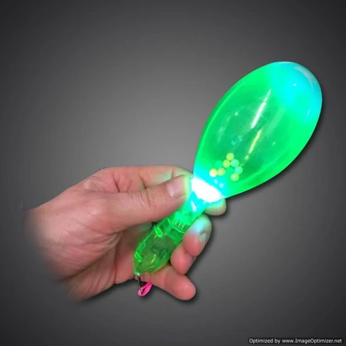 a green illuminated plastic maraca with yellow balls inside for flashing light effects
