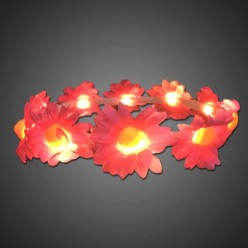 illuminated flower headband with pink and yellow Daisy flowers and LED lights on a dark background