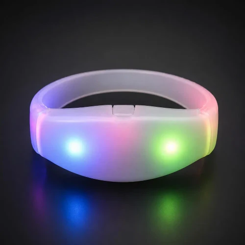 illuminated silicone wristband with multi-colored LED lights glowing in a dark background