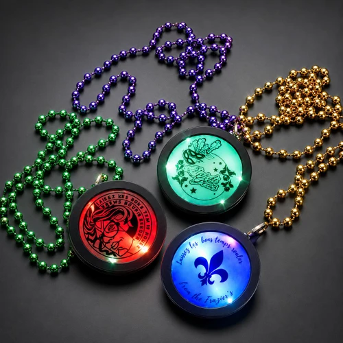 Customized Beaded Mardi Gras Flashing Medallions, illuminated flashing medallions in green, red, and blue with Mardi Gras themed designs and beaded necklaces.