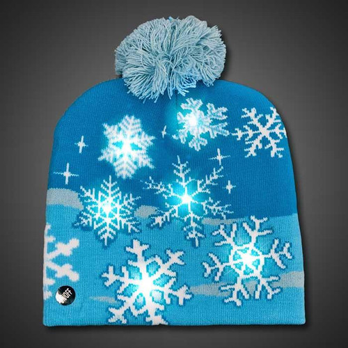 LED Beanie Christmas Snow Sock Hat, blue knit winter beanie with snowflake pattern and glowing LED lights, and a fluffy pom-pom on top.