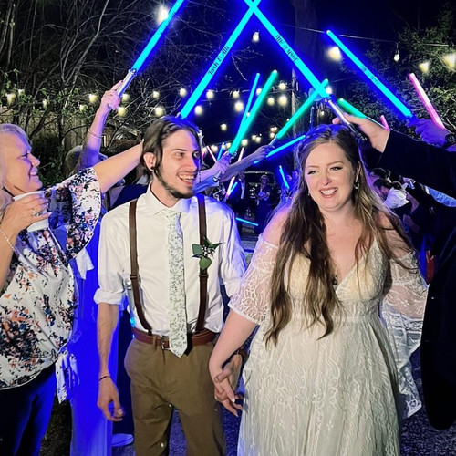 Customized Lightsaber Sword, vibrant neon-lit lightsaber duel at a celebration event.