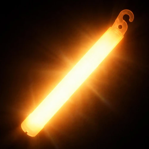 Orange 6-inch Revolution lightstick glowing with intense flare