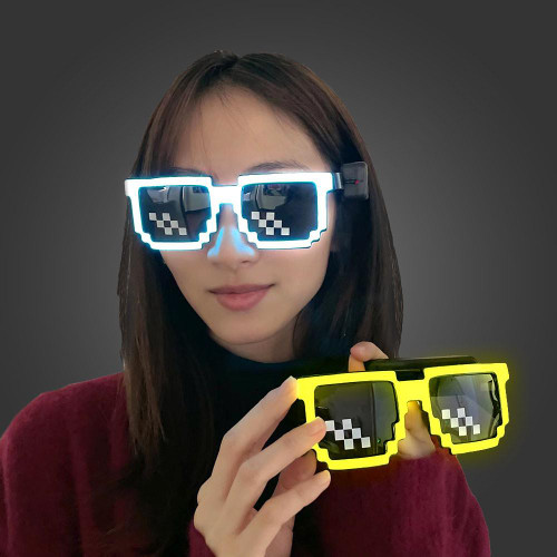 Light Up Pixel Meme Sunglasses, woman wearing illuminated pixelated meme sunglasses with pixel design on the lenses.