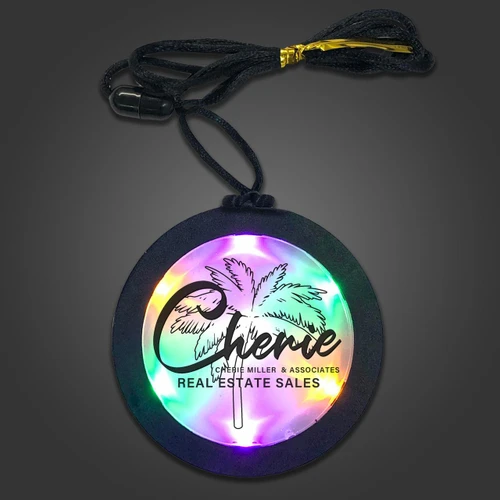 illuminated circular medallion with rainbow LEDs and palm tree design