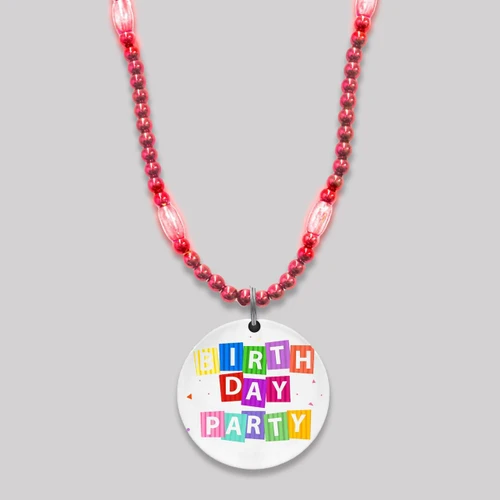 featuring pink beads and a festive birthday party design on the medallion