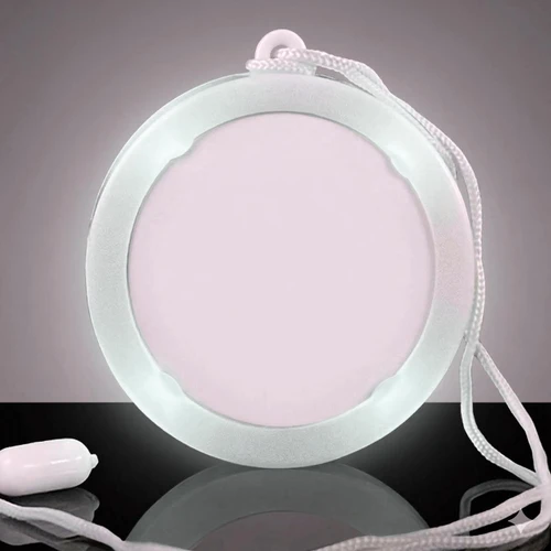glowing circular medallion with a white light, pendant design with a white cord