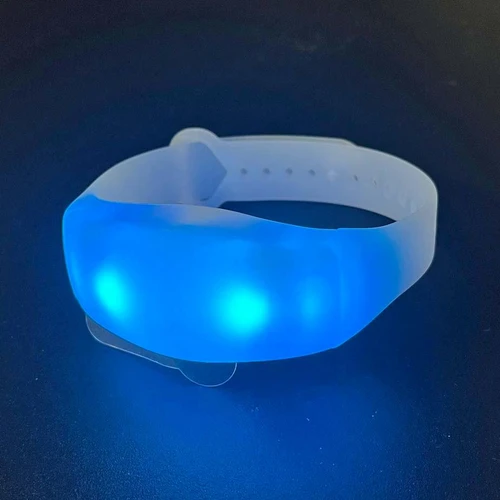 16 Mode Multicolor LED Bracelet, illuminated blue LED light on a white silicone band.