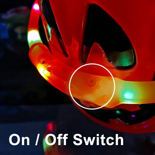 illuminated pumpkin bucket with a close-up of the On/Off switch highlight