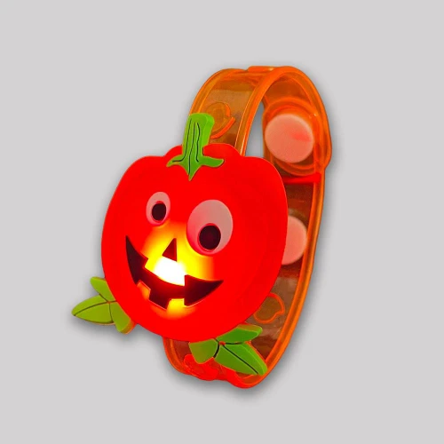 LED Flashing Pumpkin Bracelet for Kids, orange pumpkin bracelet with a smiling jack-o'-lantern face and green leaf details, illuminated in a playful design suitable for children.