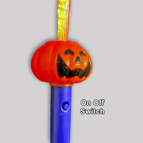 Light Up Halloween Pumpkin Fiber Optic Flashing Wand, Halloween pumpkin with a jack-o'-lantern face and fiber optic light display with on/off switch.