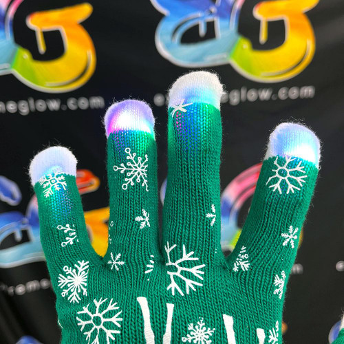 green gloves with white snowflake designs and illuminated fingertips showing bright LED lights