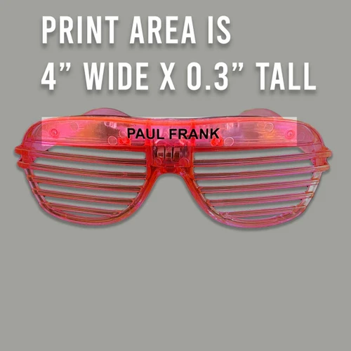 pink glow-in-the-dark shutter shades with black customizable text 'PAUL FRANK' on the frame