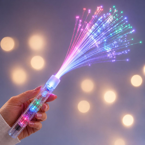 Customized Clear Fiber Optic Wand, a hand holding a transparent wand emitting colorful fiber optic lights in pink, blue, and green with a blurred bokeh background.