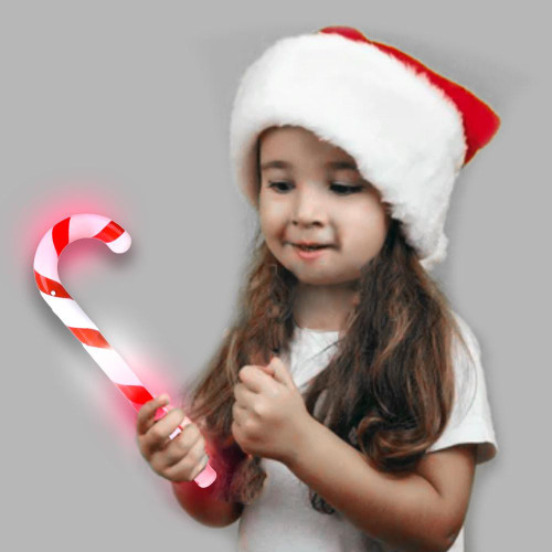Light-Up Candy Cane, a festive holiday light-up candy cane toy held by a young girl wearing a Santa hat.
