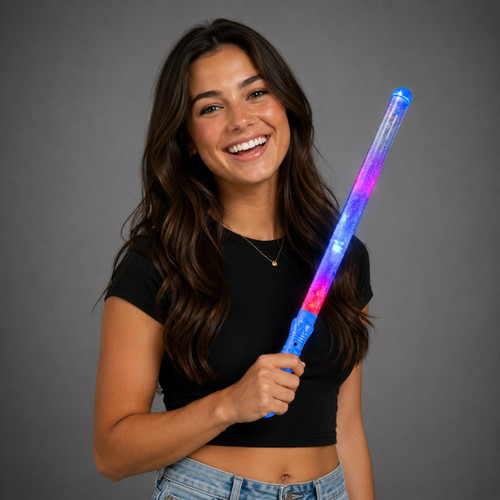 Magic Wand with Multicolored LEDs, a woman holding a luminous toy magic wand with colorful LED lights and a galaxy design, smiling against a plain gray background.