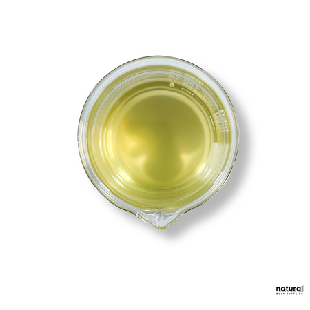 Light yellow liquid in a beaker . it is licorice root extract . wite image background Light yellow liquid in a beaker . it is licorice root extract . wite image background