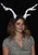 Light-Up Deer Antler White LumenHorns- glowing antlers worn by female model