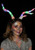 Light-Up Deer Antlers Multi-Color LumenHorns- worn by female model, glowing