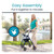 A woman in a teal top and beige pants stands with a blue Vive Aluminum Lightweight Rollator by a serene lake, surrounded by palm trees and a building. A woman in a teal top and beige pants stands with a blue Vive Aluminum Lightweight Rollator by a serene lake, surrounded by palm trees and a building.