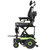 Green Invacare SRX-20MP power wheelchair raised via built-in lift mechanism; scissor-style frame elevates seat for transfers or accessibility. Large rear wheels and cushioned seat shown. Green Invacare SRX-20MP power wheelchair raised via built-in lift mechanism; scissor-style frame elevates seat for transfers or accessibility. Large rear wheels and cushioned seat shown.